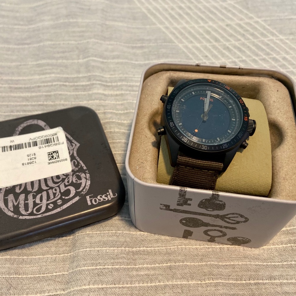 Green and black Fossil watch